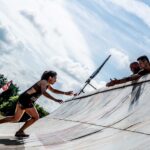 Participant running up the Tough Mudder obstacle Everest 2.0