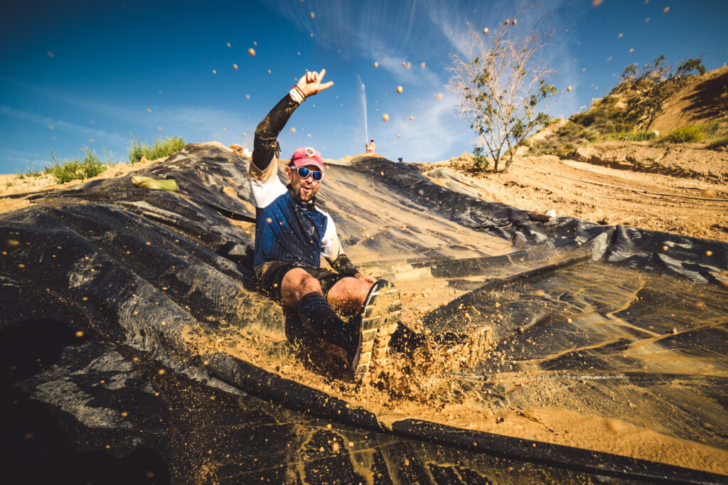 man sliding down on obstacle 