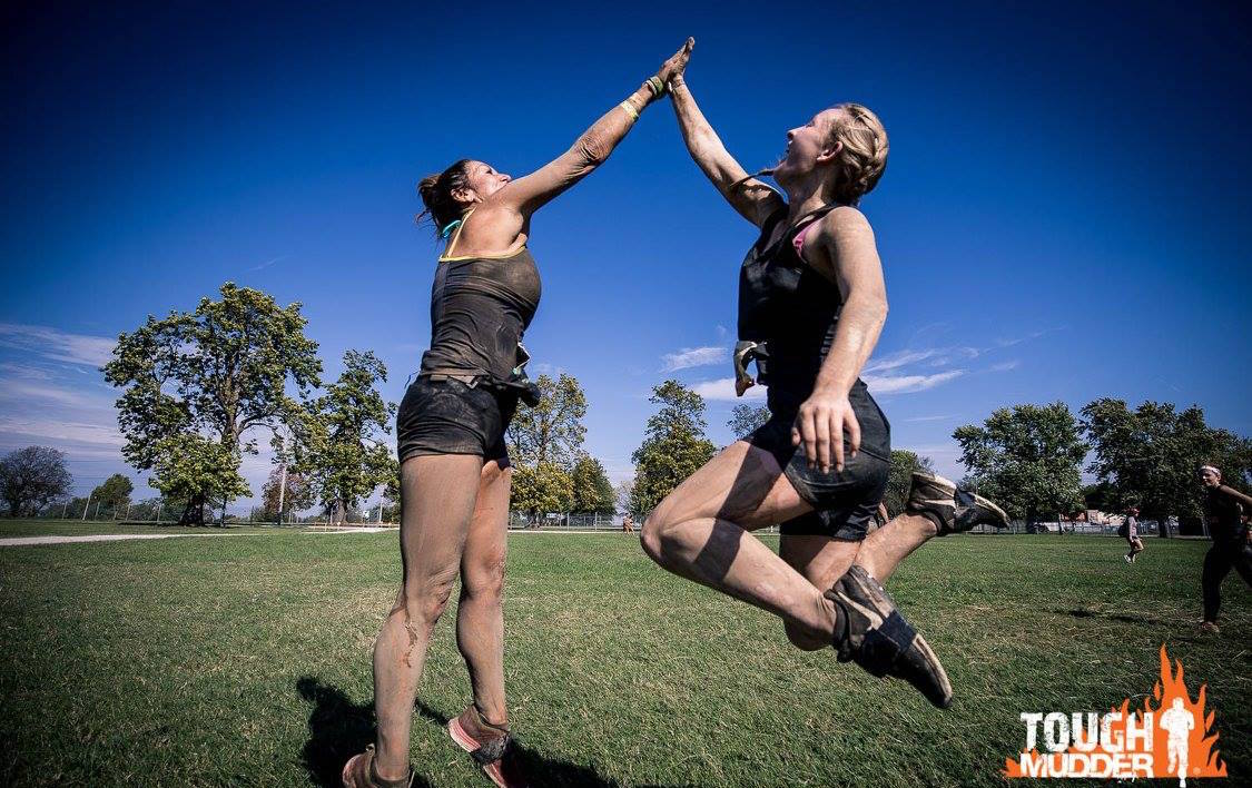 Girls high five after endurance event