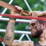 Participant holding tightly in a rope with serious face