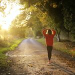 Woman running in woods